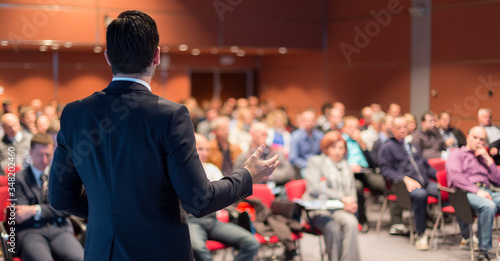 Fototapeta Speaker giving a talk on corporate business conference