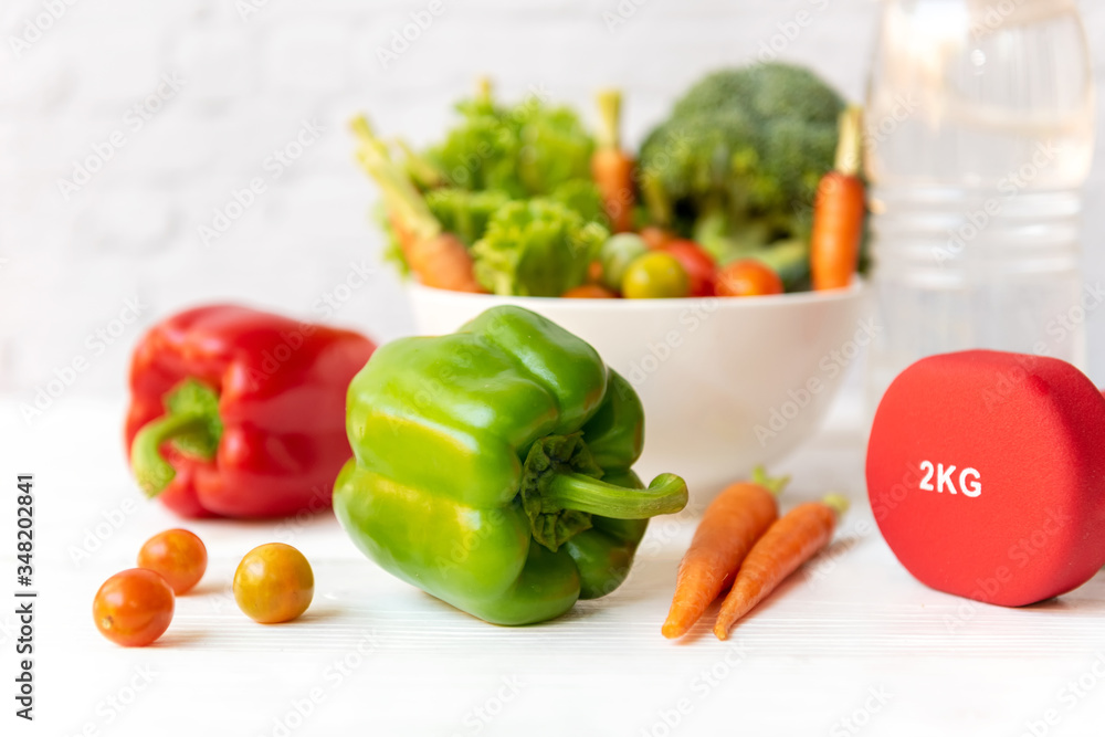 Diet Healthy food and lifestyle health concept. Sport exercise equipment workout and gym background with nutrition detox salad for fitness style. Healthy Concept. Diet Healthy food and lifestyle health concept. Sport exercise equipment workout and gym background with nutrition detox salad for fitness style. Healthy Concept.