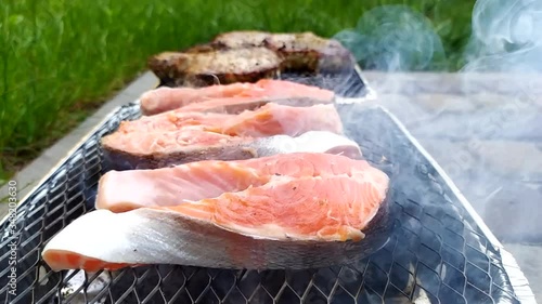 Steaming salmon steak on a grill