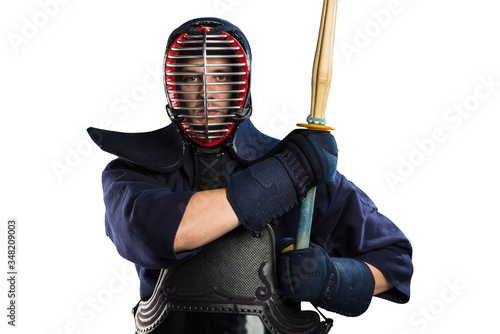 male in tradition kendo armor with shinai (bamboo sword). shot in studio. Isolated with clipping path on white background photo