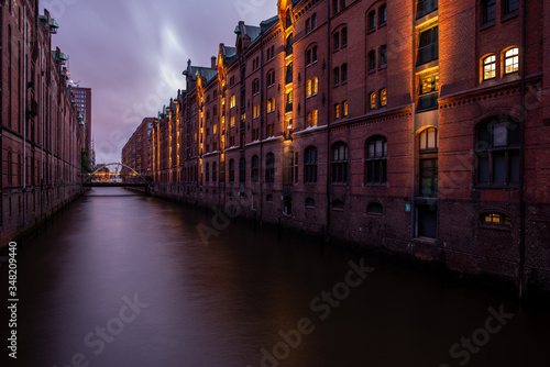 storage city in hamburg in the evening light after sunset with illuminated red brick facades tourist attraction in hamburg
