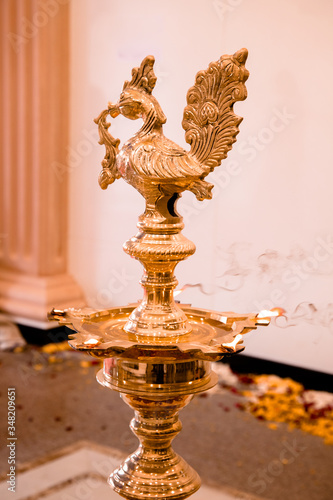 Traditional south indian brass oil lamp 'Nilavilakku '. During events like housewarming, marriage etc., the Nilavilakku is lighted before starting the rituals