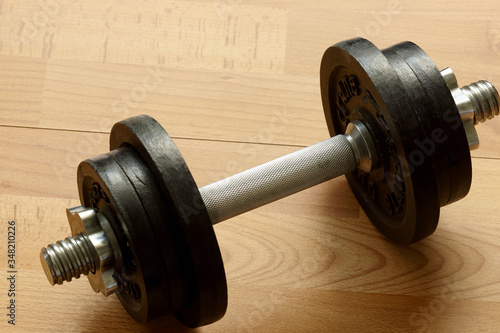 dumbbell on a wooden background