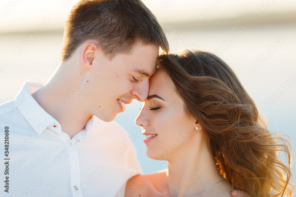 Newlyweds hugging in the desert at sunset Newlyweds hugging in the desert at sunset