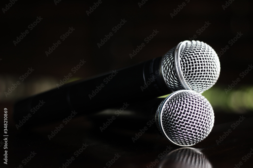 Close up Microphone voice speaker on dark background. radio microphones. wireless sound transmission system. soft focus Two mics Close-up