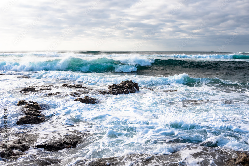 El Cotillo Beach, Fuerteventura, seething ocean, waves, stones El Cotillo Beach, Fuerteventura, seething ocean, waves, stones