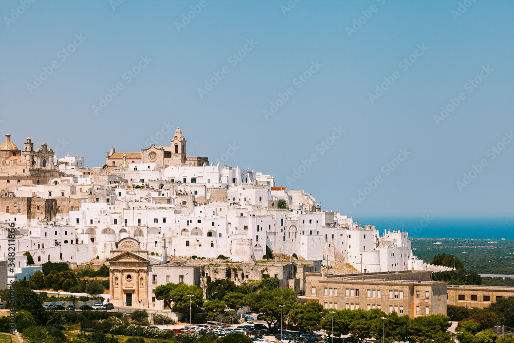 Ostuni white town and Madonna della Grata church with clean blue sky, Brindisi, Apulia, southern Italy, Europe. Panorama view