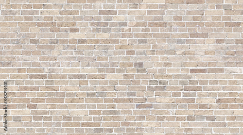 Brick wall seamless texture. Beige stone pattern background photo