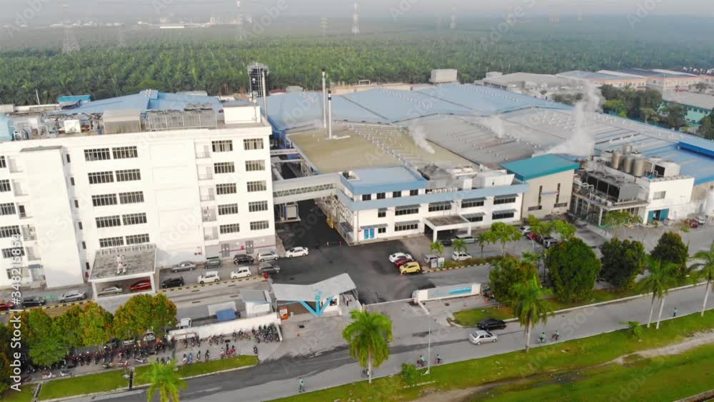 Vehicle Passing by, Pedestrian Walking By and Smokes Coming From Factory Top View - Descending Vehicle Passing by, Pedestrian Walking By and Smokes Coming From Factory Top View - Descending