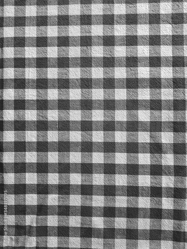 Black and white checkered fabric background. Black and white checkered fabric background.