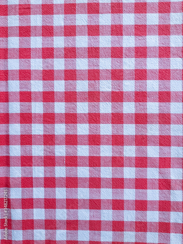 Red, white and pink checkered fabric background.
