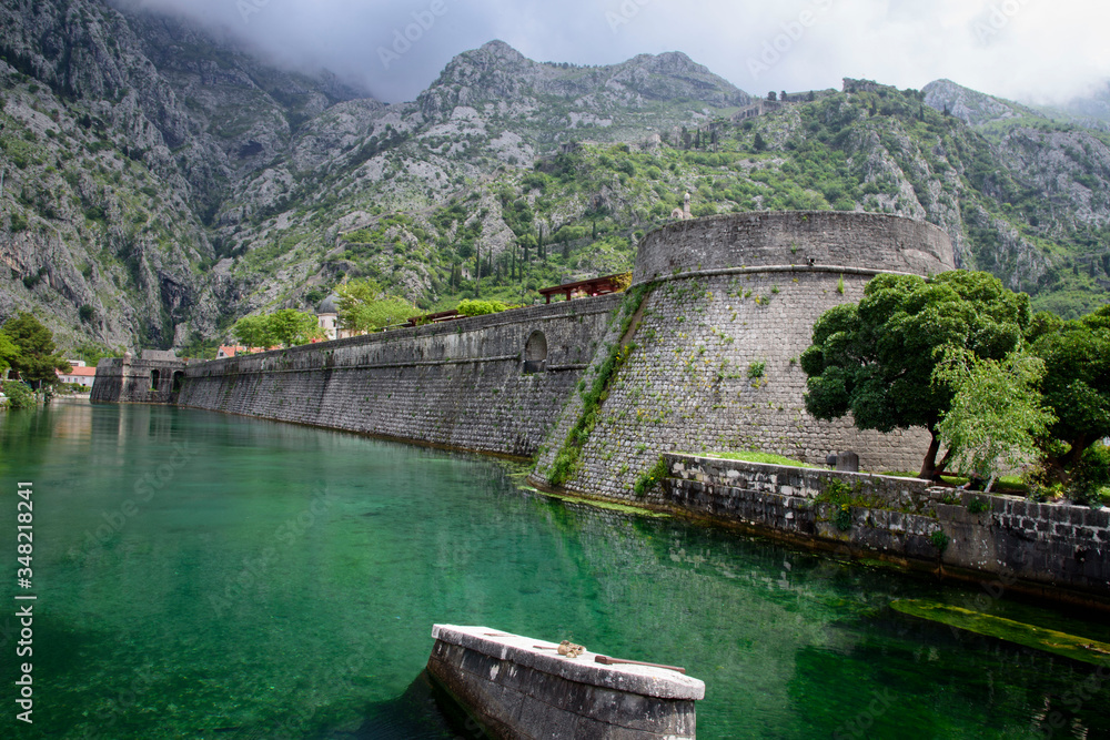 Walled fortification, in the mountains of Kotor, a city located in a bay of the Adriatic Sea, in Montenegro, Europe Walled fortification, in the mountains of Kotor, a city located in a bay of the Adriatic Sea, in Montenegro, Europe