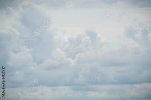 Fototapeta Naklejka Na Ścianę i Meble -  A beautiful overcast sky covered with soft, wispy clouds which fill the frame, could be used for wallpapers, business wallpapers, sky replacement and more