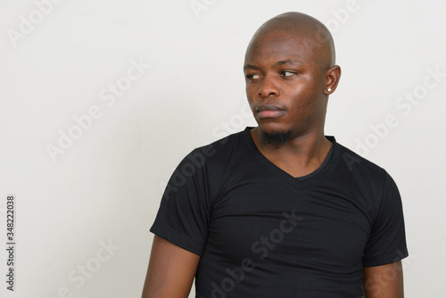 Young bald African man thinking and looking away © Ranta Images