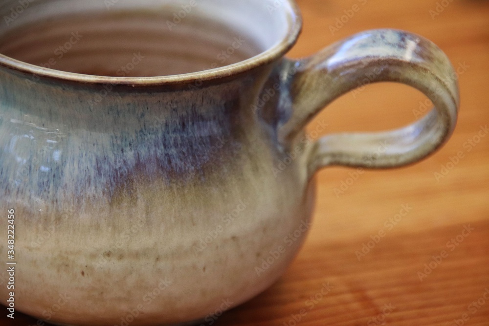 Coffee mug on wooden table, extreme closeup with shallow DOF, horizontal. Coffee mug on wooden table, extreme closeup with shallow DOF, horizontal.