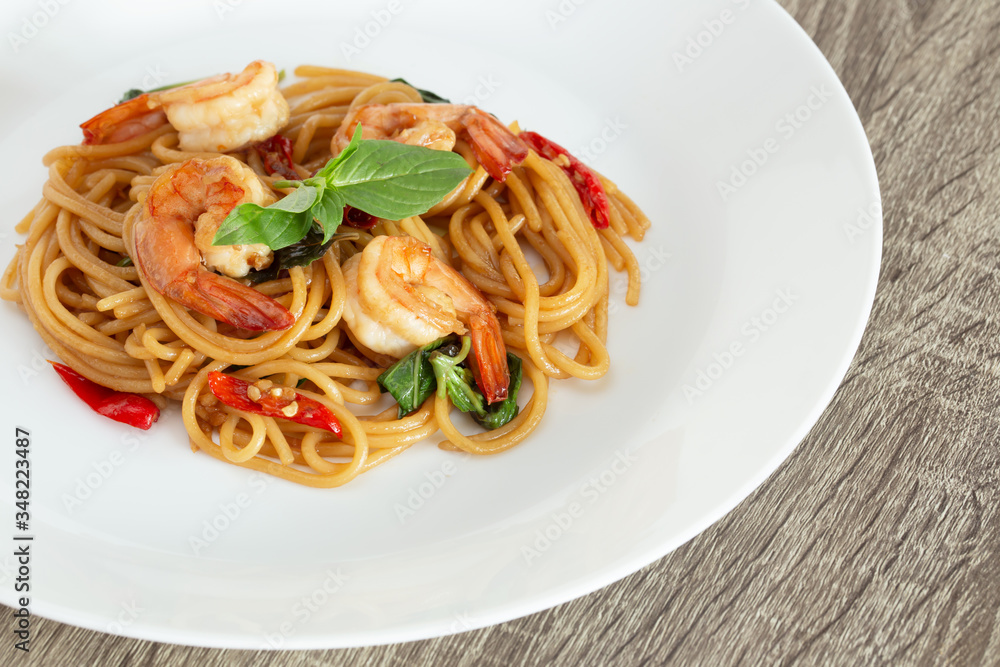 Shrimp Keemao Spaghetti on a White Plate, Thai Fusion Food Shrimp Keemao Spaghetti on a White Plate, Thai Fusion Food