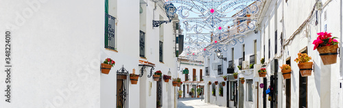 Cuadro en lienzo Panoramic image white copy space view, empty street famous village of Mijas in Spain