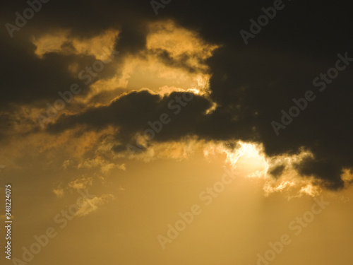 The dark monsoon clouds covering the face of the summer sun