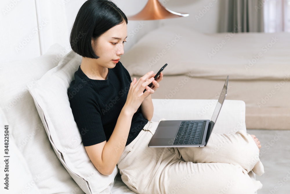 Attractive asian female working with computer laptop at home. Analyzing online data to success business Attractive asian female working with computer laptop at home. Analyzing online data to success business