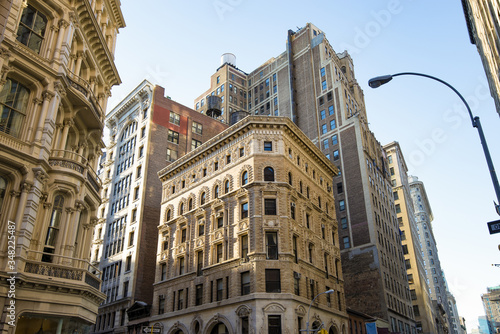 View of historic buildings on Broadway in downtown of Manhattan in New York City NYC