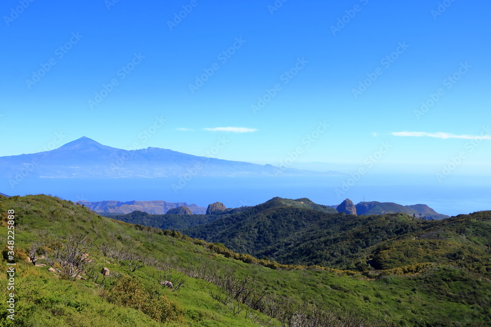 View over the national park Garajonay on La Gomera. In the background the island Tenerife with the Volcano Pico de Teide