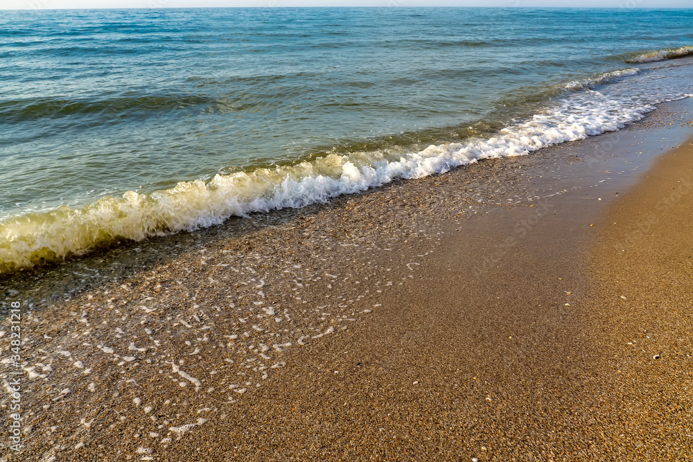 Soft wave of the sea on the sandy beach Soft wave of the sea on the sandy beach