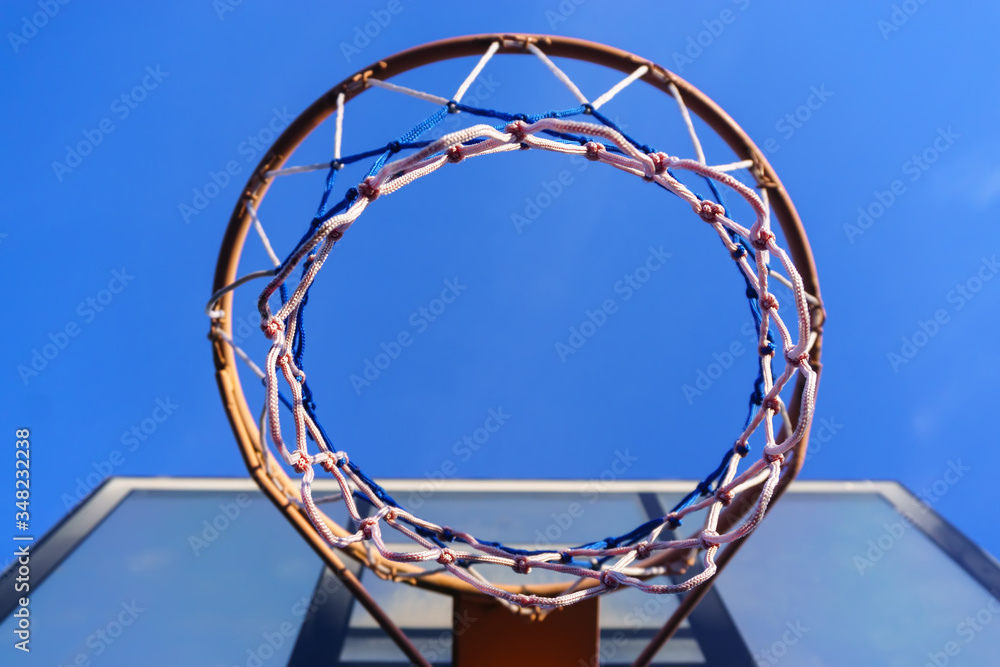 Basketball shield with a basket on the sky background Basketball shield with a basket on the sky background