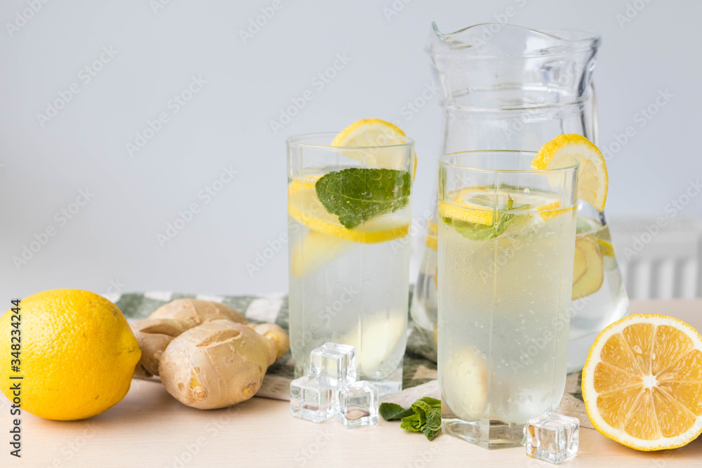 Two glasses of ginger lemonade on the table, useful for immunity ginger lemonade Two glasses of ginger lemonade on the table, useful for immunity ginger lemonade