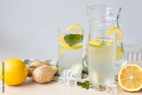 Two glasses of ginger lemonade on the table, useful for immunity ginger lemonade