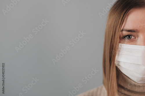 Portrait of One Beautiful Girl in White Medical Mask