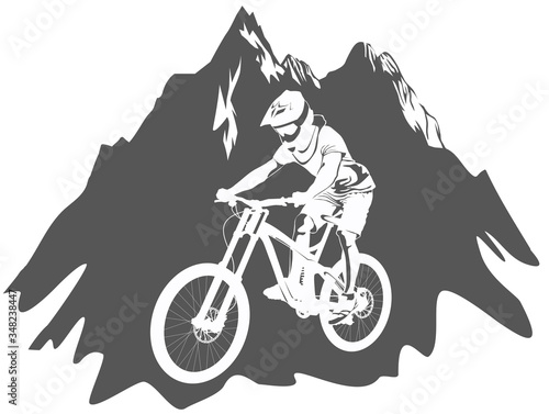 Silhouette of a cyclist riding a mountain bike