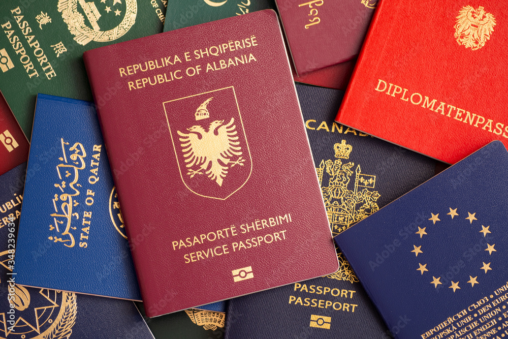 Service passport of Albania on the background of various documents of the world. Service passport of Albania on the background of various documents of the world.