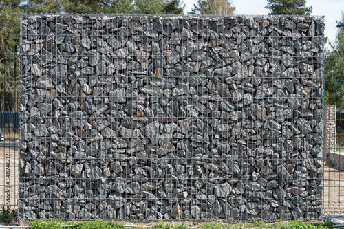 Gabion, metal basket filled with thick stones