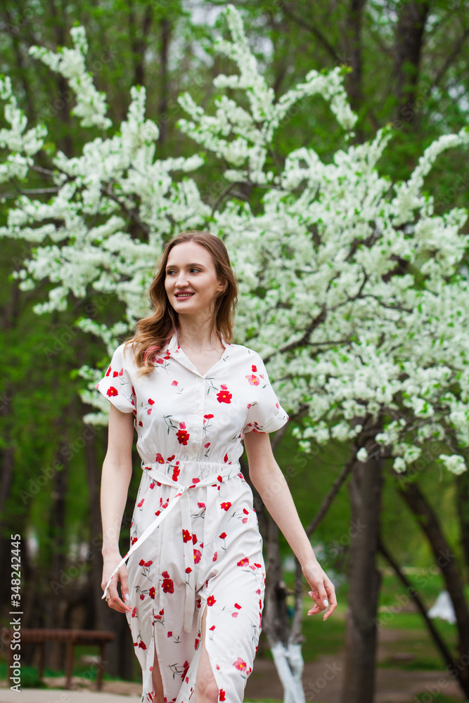 Portrait of a young beautiful blonde woman in a white dress Portrait of a young beautiful blonde woman in a white dress