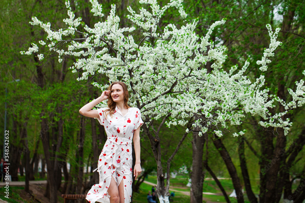 Portrait of a young beautiful blonde woman in a white dress Portrait of a young beautiful blonde woman in a white dress