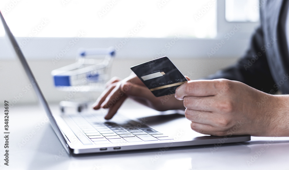 women use laptop to register online purchases using credit card payments, Convenience in the world of technology and the internet, Shopping online and banking online concept. women use laptop to register online purchases using credit card payments, Convenience in the world of technology and the internet, Shopping online and banking online concept.
