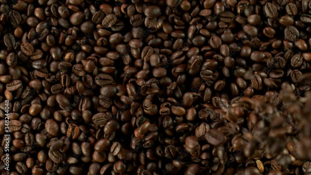 Super slow motion of falling coffee beans. Filmed on high speed cinema camera, 1000 fps. Super slow motion of falling coffee beans. Filmed on high speed cinema camera, 1000 fps.