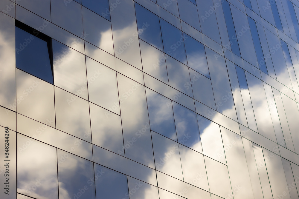 Reflections of the sky on a glassy building Reflections of the sky on a glassy building