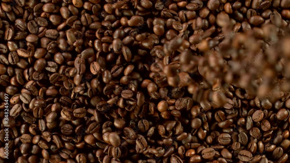 Super slow motion of falling coffee beans. Filmed on high speed cinema camera, 1000 fps. Super slow motion of falling coffee beans. Filmed on high speed cinema camera, 1000 fps.