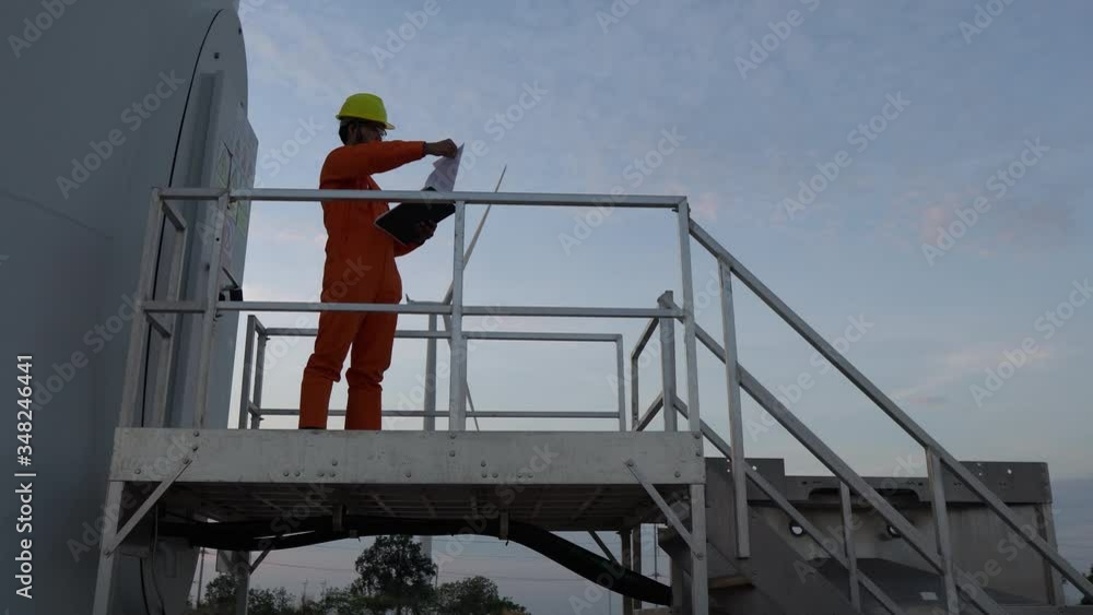 custom made wallpaper toronto digitalAsian man engineer working and holding the report at wind turbine farm Power Generator Station on mountain,Thailand people
