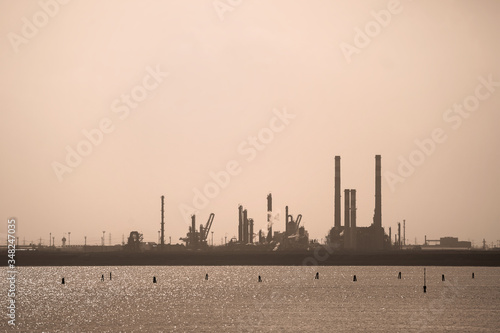 petrochemical plant silhouette, industrial scene in Porto Marghera (Venice - Italy) storage and treatment of toxic waste in one of the most polluted areas of the North East
