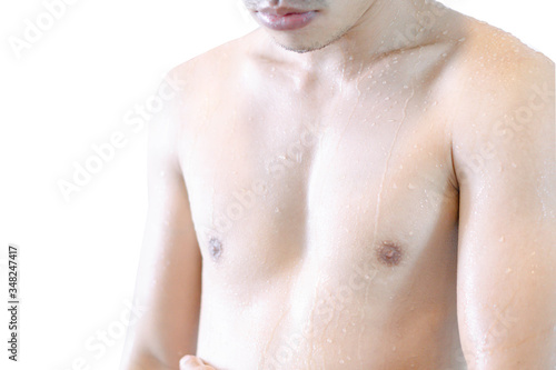 Closeup handsome asian man taking a shower on white background ,vintage tone, selective focus