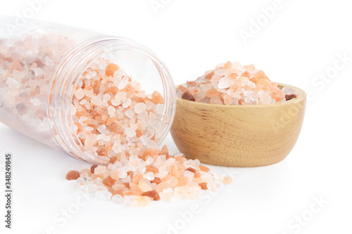 Himalayan pink salt in plastic bottle isoleted on white background, healthy concept