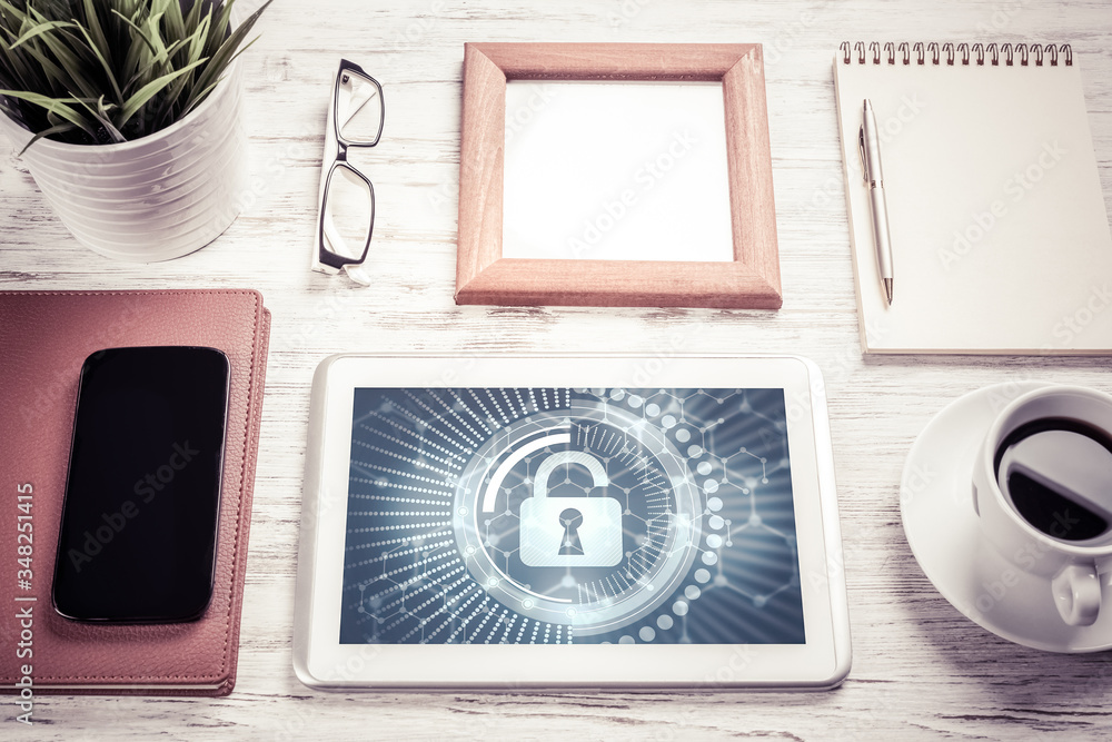 Naklejka premium Web security and technology concept with tablet pc on wooden table