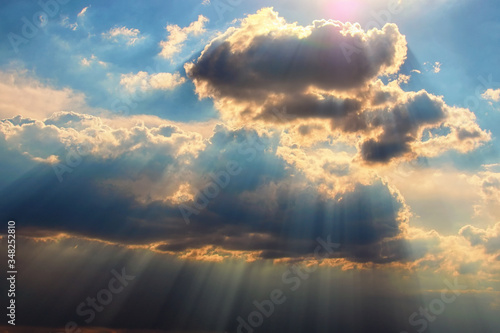 Astonishing blue sky with colorful white clouds. Abstract sun beam line light shining through the clouds. Sunbeam through the clouds on beautiful sky. Ukraine © evgenij84