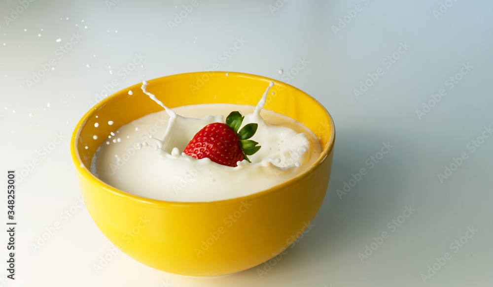strawberry falling on bowl of milk
strawberry falling on bowl of milk