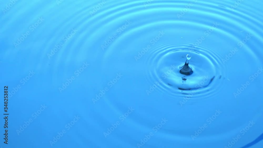 Drops falling in water leaving circles on the water. Slow motion Drops falling in water leaving circles on the water. Slow motion
