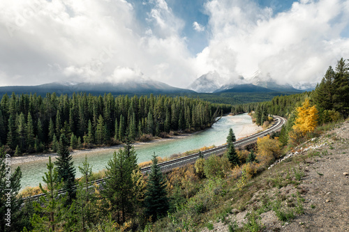 Railway with rocky mountains and cloudy in autumn valley at Morant's Curve