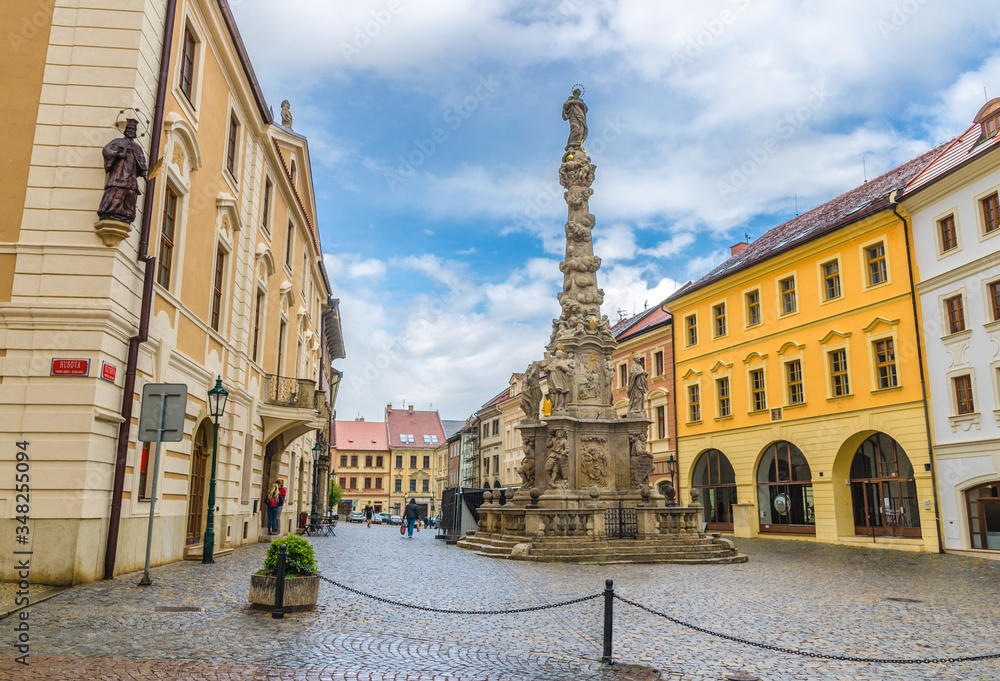 The Plague Column Morovy sloup or Column of the Virgin Mary Immaculate baroque style column in Kutna Hora historical Town Centre with cobblestone square, Central Bohemian Region, Czech Republic