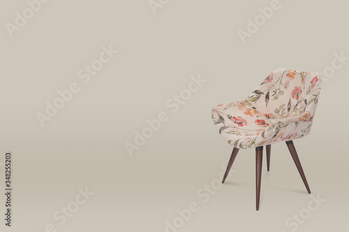 armchair. Modern designer chair on wall background